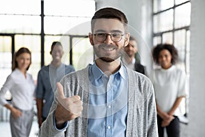 Portrait of smiling man show thumb up give recommendation