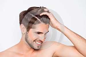 Portrait of smiling man showing his healthy hair without furfur