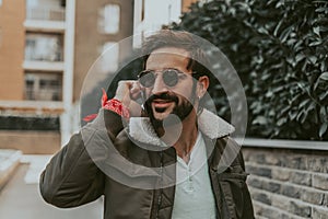 Portrait of a smiling man talking on the phone