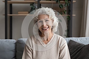Portrait of smiling mature woman relax at home