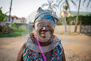 Portrait of a smiling middle aged african woman outside outdoors