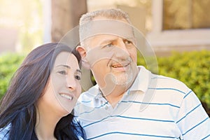 Portrait of smiling middle-aged couple looking forward