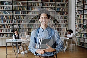Portrait of smiling millennial Jewish male student.