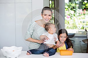 Portrait of smiling mother with children