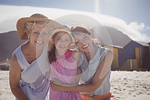 Portrait of smiling multi-generation family at beach