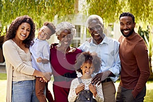 Portrait Of Smiling Multi-Generation Female Family At Home In Garden Together