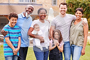 Portrait Of Smiling Multi-Generation Mixed Race Family In Garden At Home