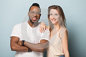 Portrait of smiling multiracial couple posing in studio