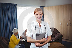 Portrait of a smiling nurse with senior