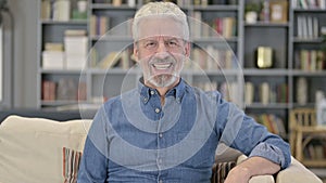 Portrait of Smiling Old Man Looking at the Camera