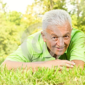 Portrait of smiling old man in the park