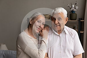 Portrait of smiling old mature retired family couple.