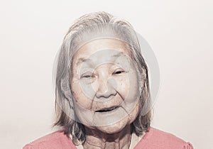 Portrait of a smiling old woman with white hair photo