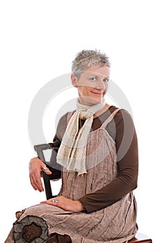 Portrait of smiling older woman sitting sideways
