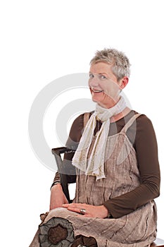 Portrait of smiling older woman sitting sideways