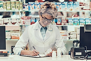 Portrait Smiling Pharmacist Working in Drugstore