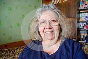 Portrait of a Smiling Positive Jewish Elderly Lady at her Home
