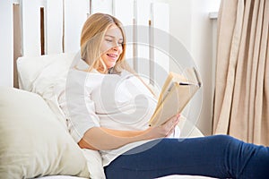 Smiling pregnant woman waiting for a boy or girl