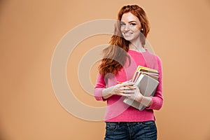 Portrait of a smiling pretty redhead girl