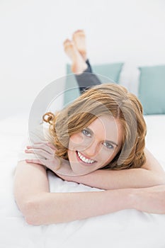 Portrait of a smiling pretty woman in bed