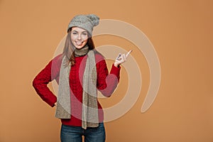 Portrait of a smiling pretty woman in a sweater