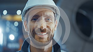 Portrait of Smiling Professional Heavy Industry Engineer / Worker Wearing Safety Uniform and Hard