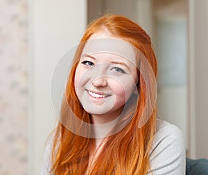 Portrait of smiling red-haired tenager