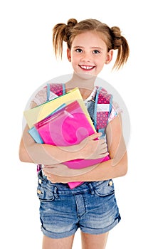 Portrait of smiling school girl child with school bag and books