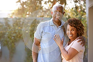 Portrait Of Smiling Senior African American Couple In Garden At Home