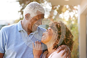 Portrait Of Smiling Senior African American Couple In Garden At Home