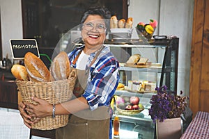 Portrait of a smiling senior Asian barista