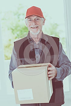 Portrait of smiling senior deliverer
