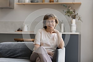 Portrait of smiling senior old retired woman in eyewear.