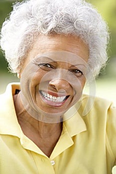 Portrait Of Smiling Senior Woman Outdoors