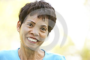 Portrait Of Smiling Senior Woman Outdoors