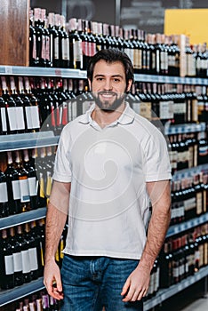 portrait of smiling shop assistant looking at camera photo