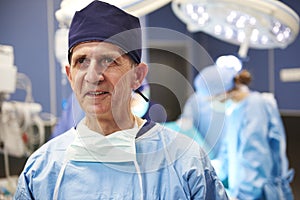 Portrait of smiling surgeon in operating room