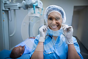 Portrait of smiling surgeon in operation room