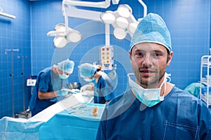 Portrait of smiling surgeon in operation room