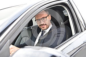 Portrait of smiling taxi chauffeur