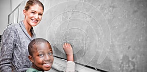 Teacher and student making addition in classroom