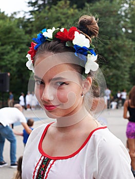Portrait of a smiling teenage girl in Russian national costume