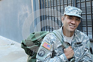 The portrait of the smiling US Army soldier with copy space on the left