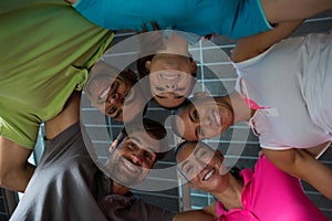 Portrait of smiling volleyball players huddling