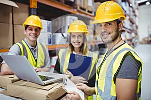 Portrait of smiling warehouse managers