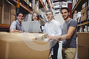 Portrait of smiling warehouse managers