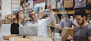 Portrait of smiling warehouse managers