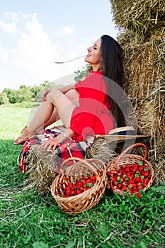 Portrait of Smiling Woman with Basket of Strawberries