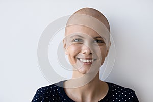 Portrait of smiling woman with cancer feel optimistic