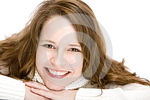 Portrait of smiling woman with chin on hands